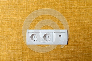 White double socket and ethernet plug on wall