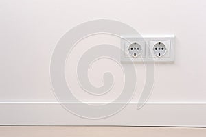 Electrical outlet on white wall. home design
