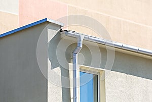 White drainpipe on wall