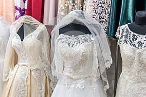 White dresses on mannequins in wedding salon