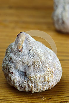 Dried fig close-up on a wooden board