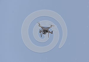 White drone flying in the sky