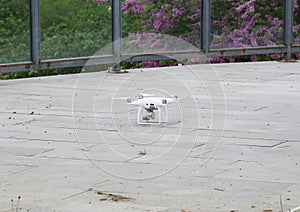 White drone staing on the ground