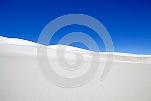 White dune at the lava field of the volcano Caraci Pampa at the Puna de Atacama, Argentina