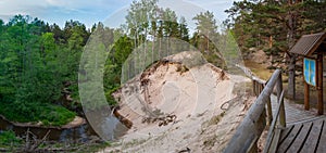 White dune near Purciems surrounded by beautiful green forest and winding river