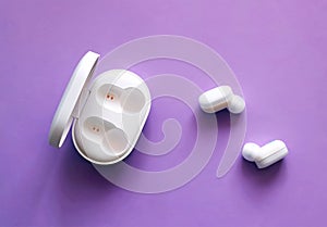 White earbuds MI True Wireless by Xiomi with built-in microphones for hands-free communication