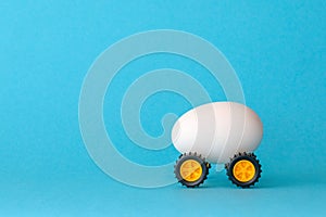 White Easter egg on wheels