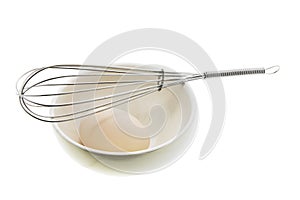 White Egg on Bowl with Egg Whisk