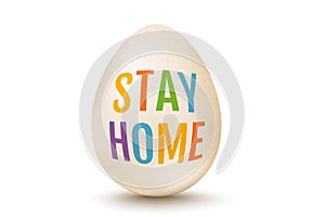 White egg for Easter with text stay home