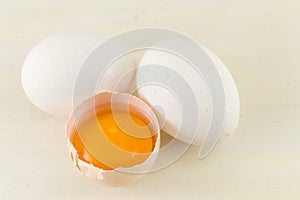 White eggs with one broken