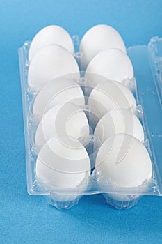 White eggs in a plastic box