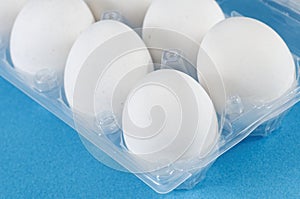 White eggs in a plastic box