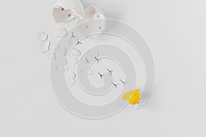 White eggshell of a broken chicken egg with shards and footprints of a chick isolated on a white background.Easter