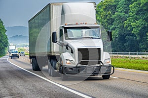 White Eighteen-Wheeler Semi On Interstate Highway