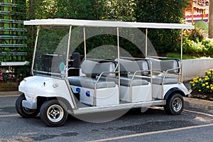 White Electric Golf Car in the Holiday Resort