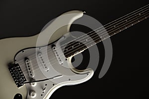 White Electric Guitar on Black