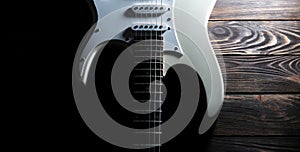 White electric guitar. Music concept. Creative style with light shadows