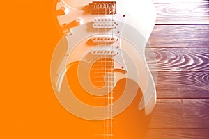 White electric guitar. Music concept. Creative style with light shadows