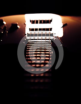 White electric guitar. Music concept. Creative style with light shadows