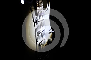 White electric guitar. Music concept. Creative style with light shadows