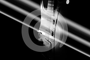 White electric guitar. Music concept. Creative style with light shadows