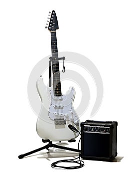 White electric guitar with small amplifier