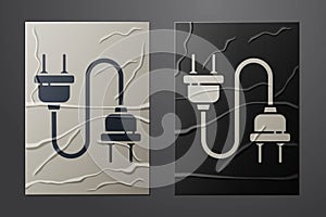 White Electric plug icon isolated on crumpled paper background. Concept of connection and disconnection of the