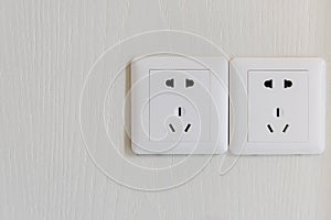 white electric plugs or outlet on wall