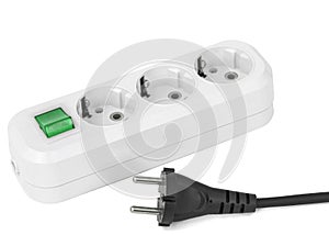 White electric splitter with green switching for for simultaneous switching of several electrical appliances, isolated on white