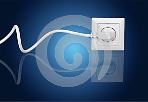 White electrical plug in the electric socket on a