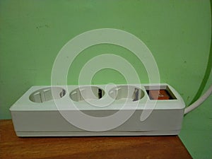 white electrical socket with three holes