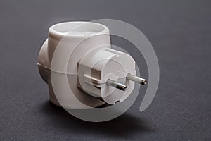 White electrical tee on a black background