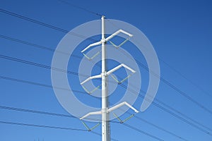 White electricity pylon and power lines