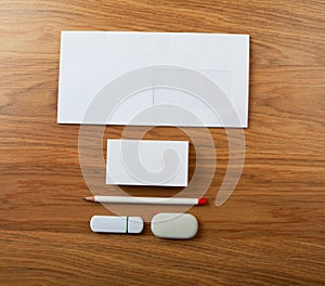 The white elements of corporate identity on a wooden background