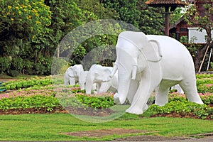 White elephant statue in the green garden