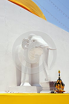White elephants sculpture on pagoda wall