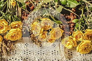White embroidered border covered with amber beads with yellow roses on black background