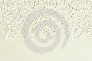 White embroidered lace on white wood