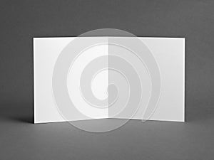 White empty card on grey to replace your design.