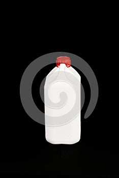 White empty plastic bottle with red cap