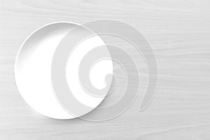 White Empty plate on old wooden background. Top view with copy s