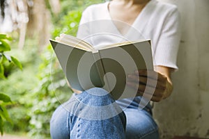 White empty text book in a woman hand