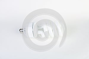 White energy saving lighbulb on white background