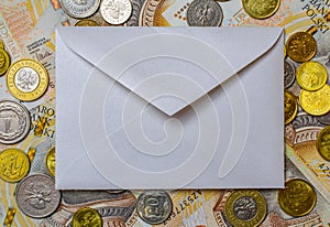 white envelope, blank note on money background, for finance and inflation