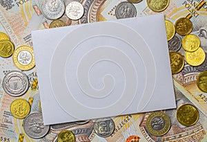 white envelope, blank note on money background, for finance and inflation