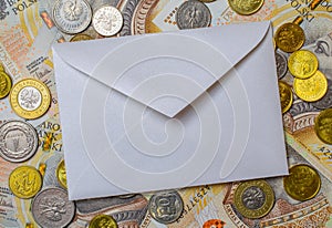 white envelope, blank note on money background, for finance and inflation