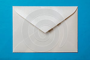 white envelope blank note pinned to a blue notice board