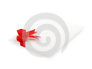 envelope of invitation or greeting card decorate with simple red ribbon bow isolated on white background