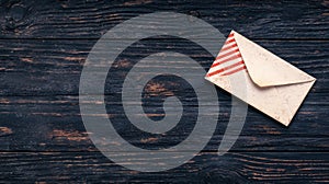 A white envelope with red stripes on the corner.