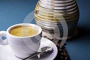 White espresso cup and saucer with brown coffee